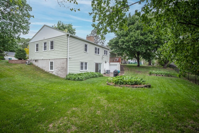 1030 Idaho Ave N, Golden Valley, MN 55427 - back of house with a chimney and a garage