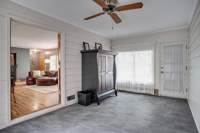 1030 Idaho Ave N, Golden Valley, MN 55427 - empty room featuring ceiling fan and crown molding