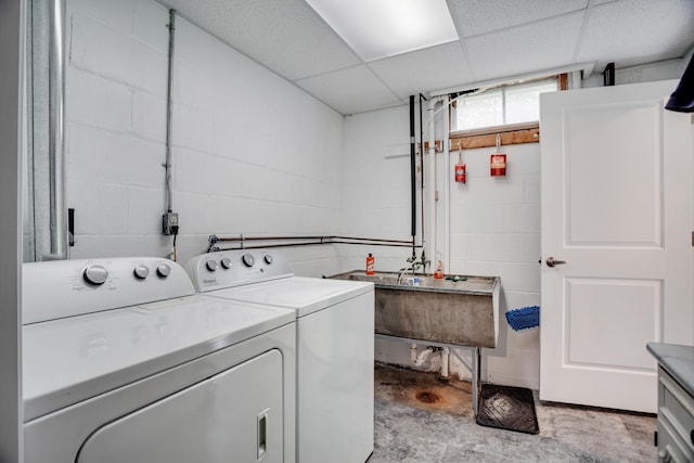 1030 Idaho Ave N, Golden Valley, MN 55427 - laundry area featuring washer and dryer and concrete block wall