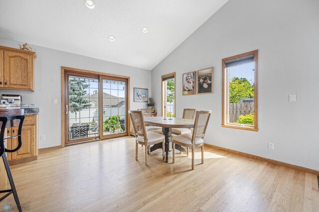 1421 55th Ave S, Fargo, ND 58104 - dining area featuring plenty of natural light, light wood-style flooring, recessed lighting, and high vaulted ceiling