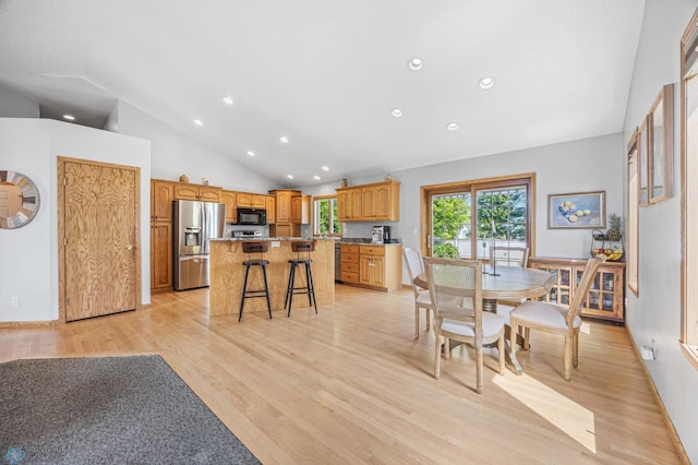 1421 55th Ave S, Fargo, ND 58104 - dining room with recessed lighting, light wood-style flooring, and high vaulted ceiling