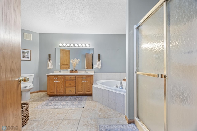 1421 55th Ave S, Fargo, ND 58104 - full bath with double vanity, a bath, a shower stall, and a textured ceiling
