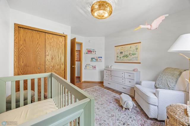 1421 55th Ave S, Fargo, ND 58104 - bedroom featuring wood finished floors and a closet