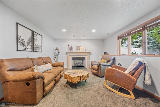 1421 55th Ave S, Fargo, ND 58104 - living room featuring a textured ceiling, carpet, recessed lighting, and a tiled fireplace