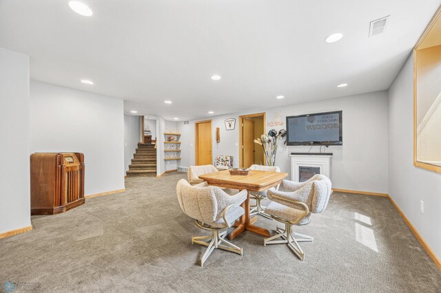 1421 55th Ave S, Fargo, ND 58104 - dining space with carpet floors, recessed lighting, stairway, and a fireplace