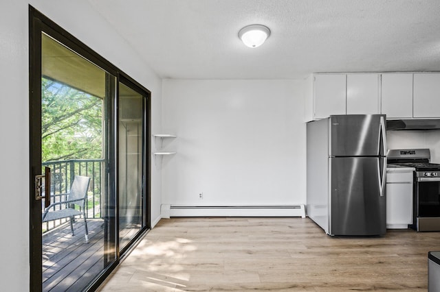 4101 Parklawn Ave Unit 320, Edina, MN 55435 - kitchen with stainless steel appliances, under cabinet range hood, a baseboard radiator, light wood-style floors, and white cabinets