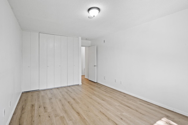 4101 Parklawn Ave Unit 320, Edina, MN 55435 - unfurnished bedroom with wood finished floors and a closet