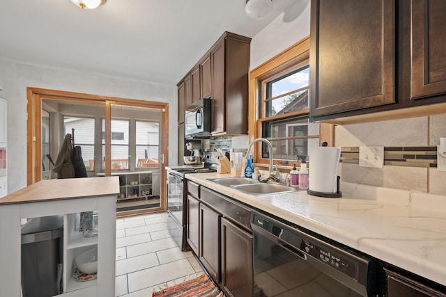 3734 Emerson Ave N, Minneapolis, MN 55412 - kitchen with black appliances, dark brown cabinets, light countertops, and light tile patterned floors