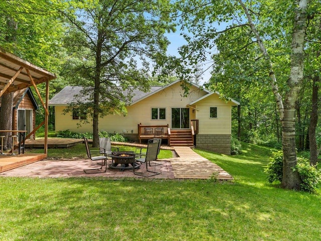 31591 Summer Dr, Breezy Point, MN 56472 - rear view of house featuring an outdoor fire pit, a patio, a deck, and a yard