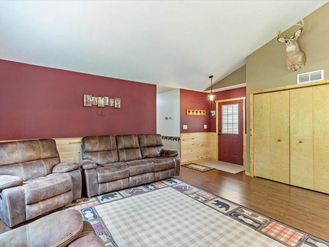 31591 Summer Dr, Breezy Point, MN 56472 - living area with wood finished floors, vaulted ceiling, wainscoting, and wooden walls