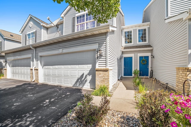 1343 Yorkshire Ln, Shakopee, MN 55379 - view of front of property with driveway and an attached garage