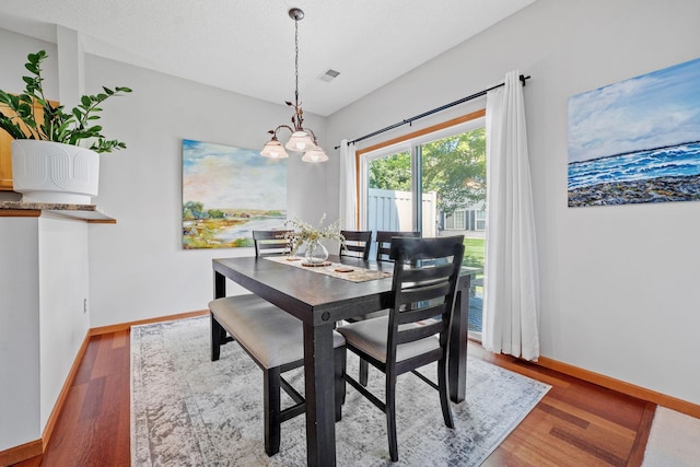 1343 Yorkshire Ln, Shakopee, MN 55379 - dining area featuring wood finished floors and a chandelier