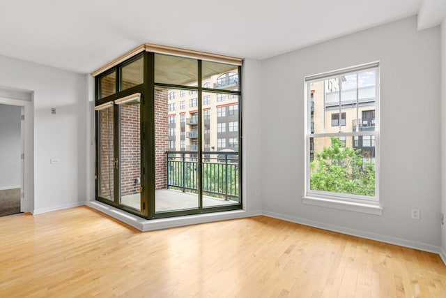 408 1st St Unit 310, Minneapolis, MN 55401 - unfurnished room with wood finished floors and baseboards