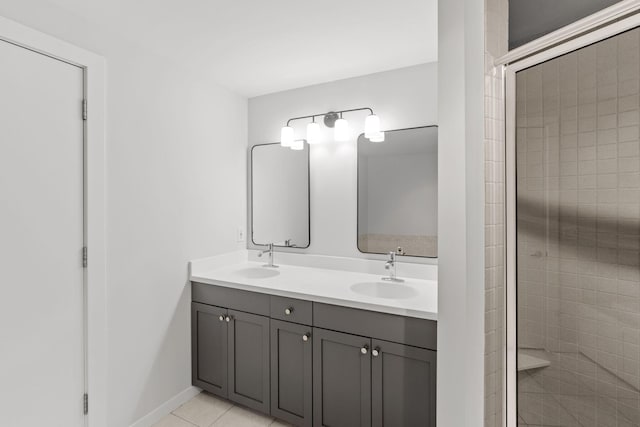 408 1st St Unit 310, Minneapolis, MN 55401 - bathroom with double vanity, a stall shower, and tile patterned floors