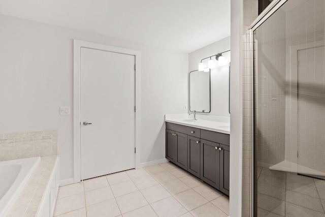 408 1st St Unit 310, Minneapolis, MN 55401 - bathroom featuring double vanity, a garden tub, a shower stall, and tile patterned flooring