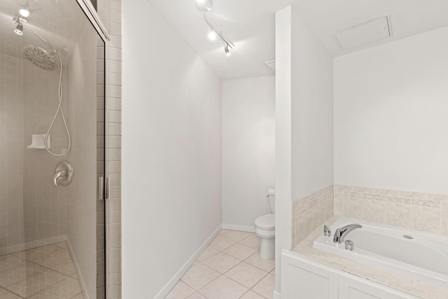 408 1st St Unit 310, Minneapolis, MN 55401 - full bath with a shower stall, a garden tub, tile patterned flooring, and track lighting