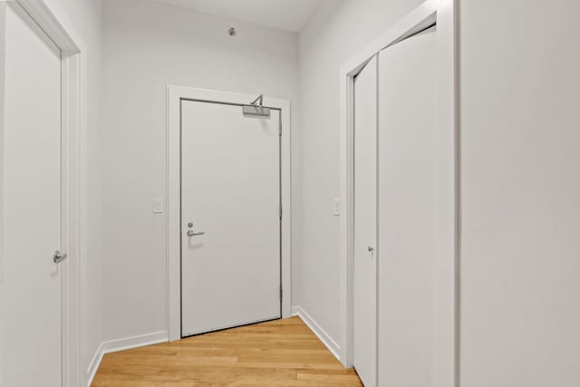 408 1st St Unit 310, Minneapolis, MN 55401 - hallway featuring light wood-type flooring and baseboards
