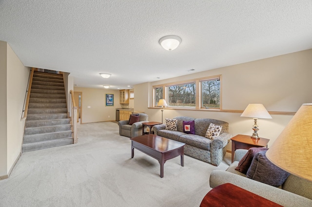 2011 117th Ln NE, Blaine, MN 55449 - carpeted living area with stairs and a textured ceiling