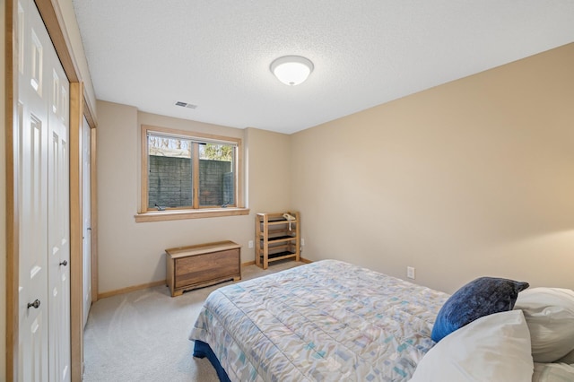 2011 117th Ln NE, Blaine, MN 55449 - carpeted bedroom featuring a textured ceiling and a closet