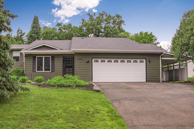 2246 Vivian Ln, Saint Paul, MN 55119 - ranch-style house featuring asphalt driveway, an attached garage, and a front lawn