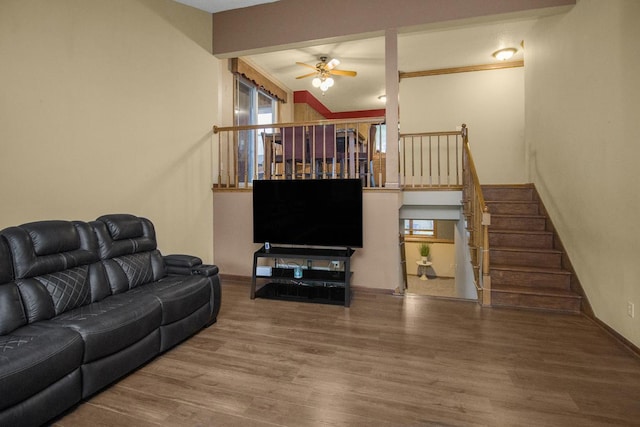 2246 Vivian Ln, Saint Paul, MN 55119 - living area featuring a ceiling fan, wood finished floors, stairs, and ornamental molding
