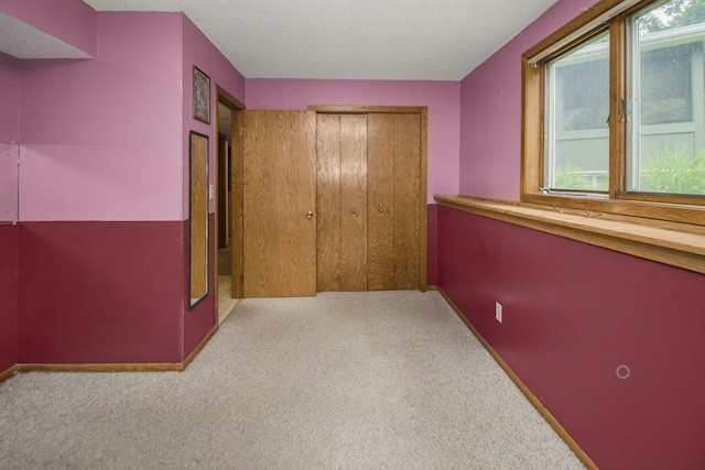 2246 Vivian Ln, Saint Paul, MN 55119 - unfurnished bedroom with multiple windows, carpet, and a closet