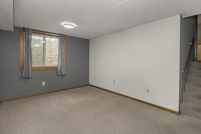 2246 Vivian Ln, Saint Paul, MN 55119 - carpeted empty room with a textured ceiling and stairway