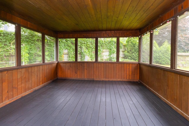 2246 Vivian Ln, Saint Paul, MN 55119 - unfurnished sunroom with hardwood / wood-style floors, wooden walls, and a deck
