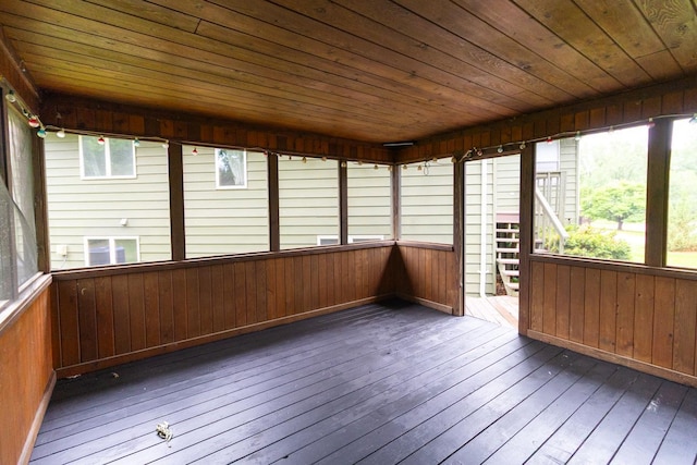 2246 Vivian Ln, Saint Paul, MN 55119 - unfurnished sunroom with hardwood / wood-style flooring, wood ceiling, wood walls, and a deck