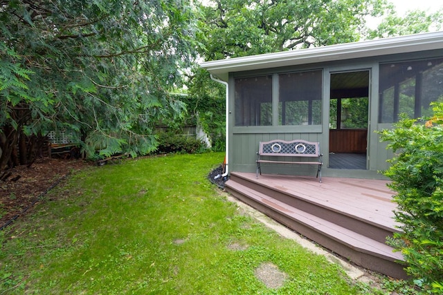 2246 Vivian Ln, Saint Paul, MN 55119 - view of grassy yard with a sunroom and a deck