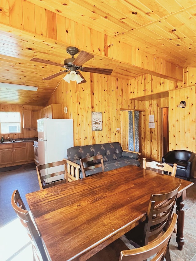 35686 Rush Lake Loop Unit 9, Rush Lake Twp, MN 56571 - dining space with wooden ceiling, wood walls, and a ceiling fan