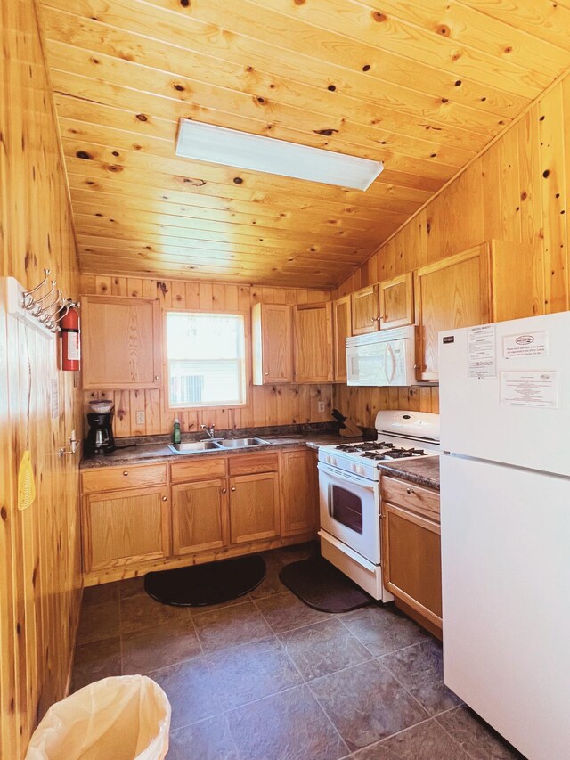 35686 Rush Lake Loop Unit 9, Rush Lake Twp, MN 56571 - kitchen featuring white appliances, wood ceiling, lofted ceiling, dark countertops, and wood walls