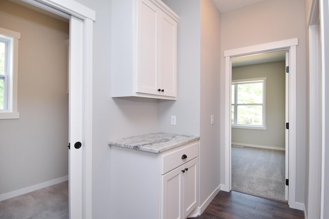 21207 Tippecanoe St NE, East Bethel, MN 55011 - hall with baseboards and dark wood-type flooring