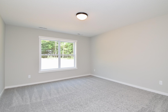 21207 Tippecanoe St NE, East Bethel, MN 55011 - carpeted spare room featuring baseboards