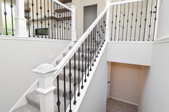 21207 Tippecanoe St NE, East Bethel, MN 55011 - stairway featuring baseboards and carpet
