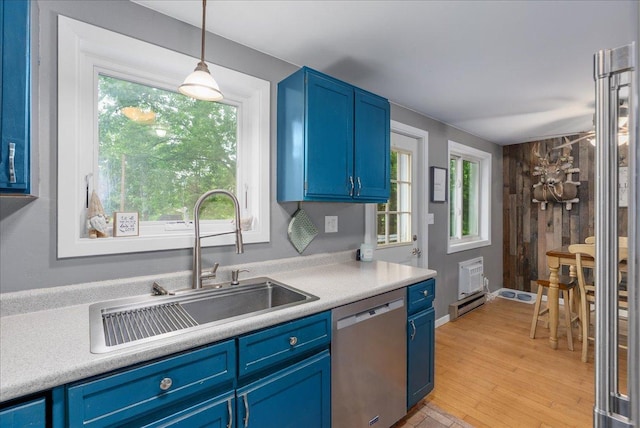 1145 Norton St, Hammond, WI 54015 - kitchen featuring dishwasher, blue cabinetry, light countertops, and light wood-style floors