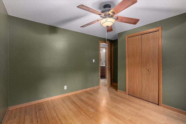 1145 Norton St, Hammond, WI 54015 - unfurnished bedroom with light wood-style floors, a closet, and ceiling fan