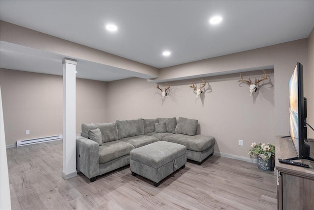1145 Norton St, Hammond, WI 54015 - living room featuring a baseboard heating unit, light wood-style floors, and recessed lighting