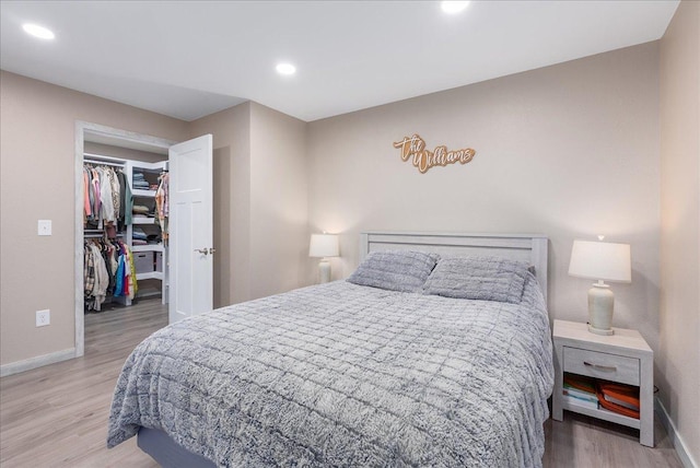 1145 Norton St, Hammond, WI 54015 - bedroom with a spacious closet, light wood-type flooring, recessed lighting, and a closet