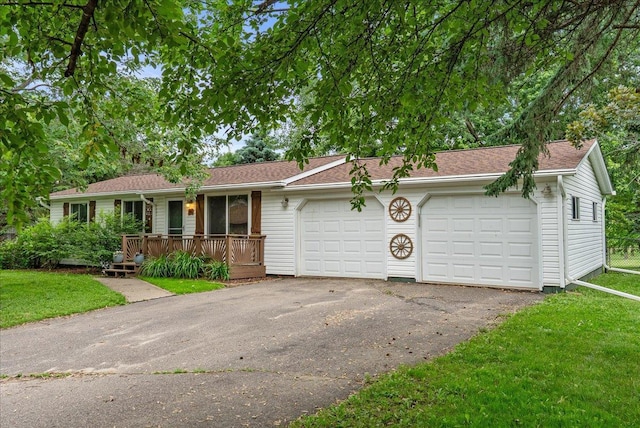 1145 Norton St, Hammond, WI 54015 - single story home with covered porch, a garage, a front lawn, and asphalt driveway