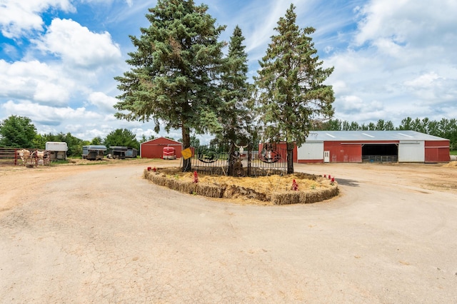 33406 151st Ave, Montgomery, MN 56069 - view of dirt / gravel road with a pole building