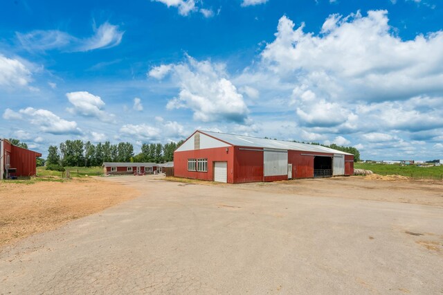 33406 151st Ave, Montgomery, MN 56069 - view of pole building featuring driveway