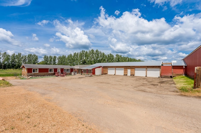 33406 151st Ave, Montgomery, MN 56069 - view of front of property featuring dirt driveway and a garage