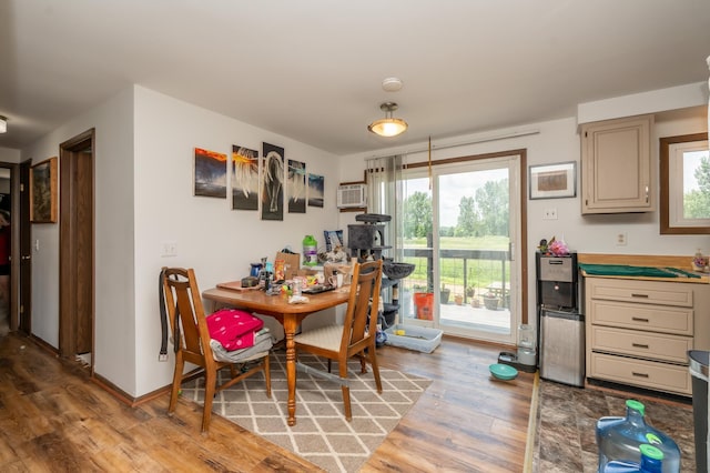 33406 151st Ave, Montgomery, MN 56069 - dining room featuring light wood-type flooring and a wall unit AC