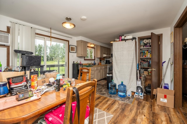 33406 151st Ave, Montgomery, MN 56069 - dining room featuring wood finished floors and a wall mounted air conditioner