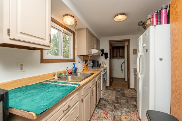 33406 151st Ave, Montgomery, MN 56069 - kitchen featuring white appliances, under cabinet range hood, light countertops, and stone finish flooring