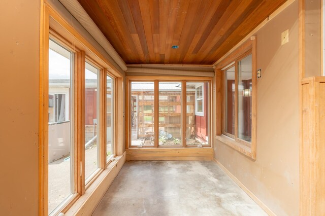 33406 151st Ave, Montgomery, MN 56069 - unfurnished sunroom featuring wooden ceiling and unfinished concrete flooring