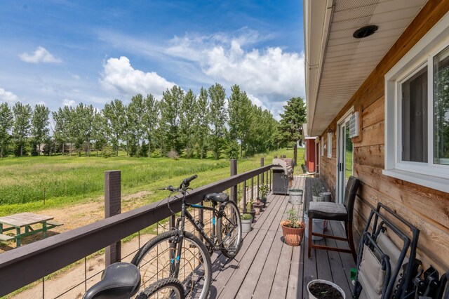 33406 151st Ave, Montgomery, MN 56069 - wooden terrace with area for grilling and view of scattered trees