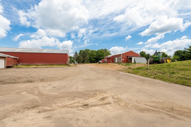 33406 151st Ave, Montgomery, MN 56069 - view of yard featuring an outbuilding, a garage, an outdoor structure, and driveway