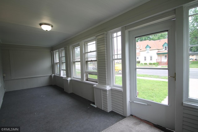 209 Cleveland St SW, Silver Lake, MN 55381 - unfurnished sunroom featuring carpet, plenty of natural light, and ornamental molding